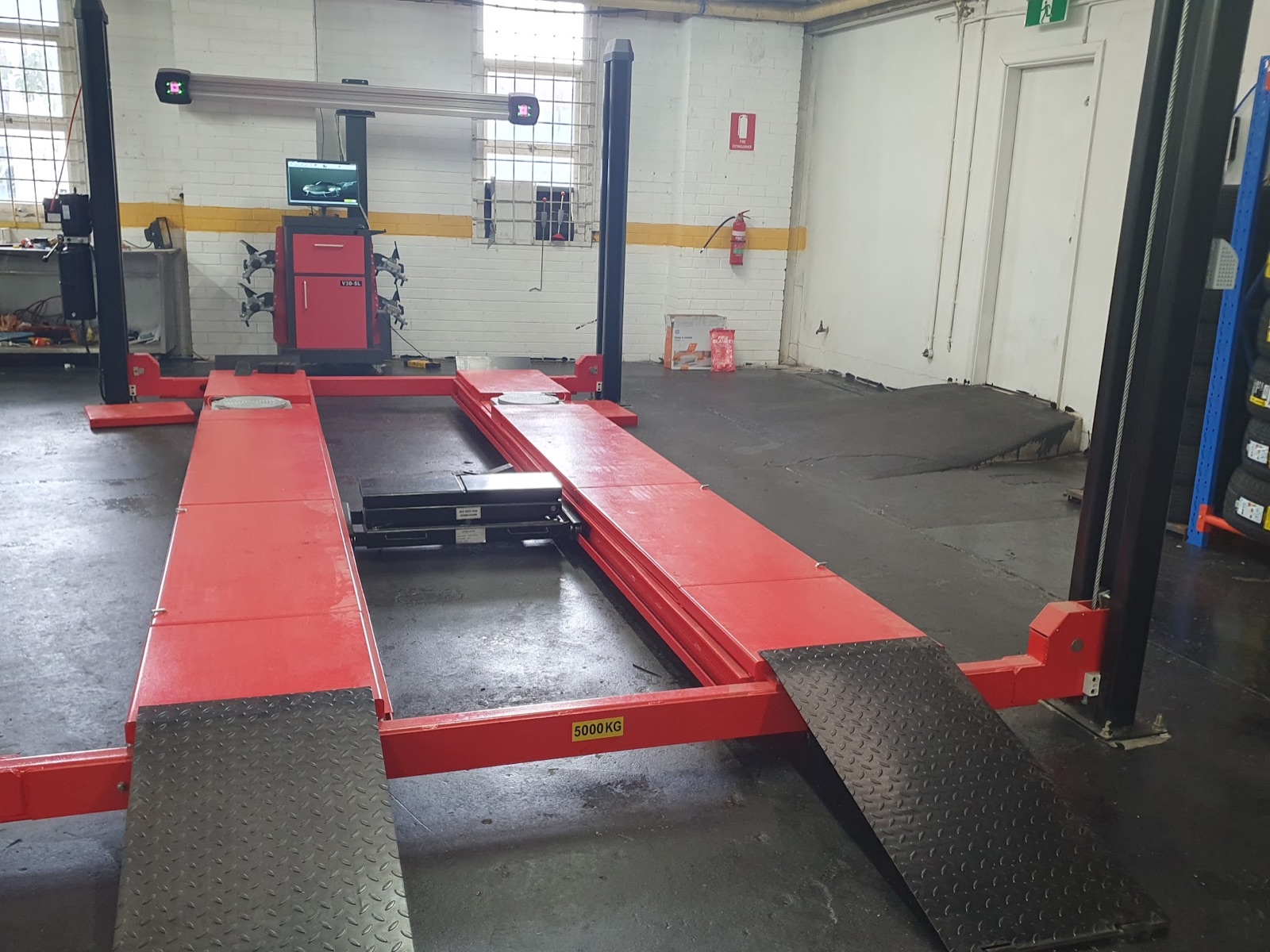 Computer-guided wheel alignment equipment inside Crown Workshop